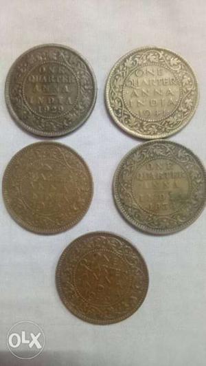 Five Round Gold-colored 1 Indian Coins