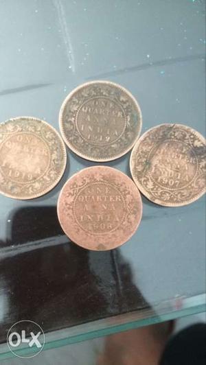 Four Silver-colored One Quarter Indian Anna Coin