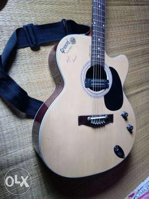 Grason unused acoustic guitar... with strap...