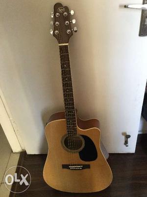 Guitar in excellent condition with tuner, brand