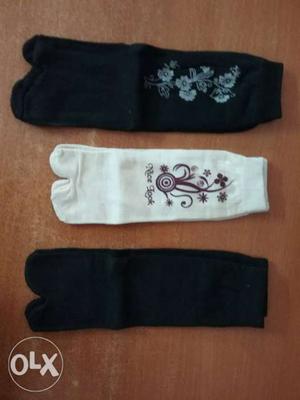 Three White And Black Knit Gloves