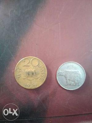 Two Round Silver-colored 25 And Gold-colored 20 Indian Paise