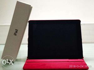Apple ipad 2 with a royal red colored cover