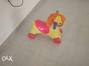 Baby's Red And Yellow Ride-on Horse Toy