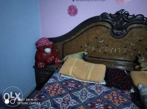 Brown And Black Wooden Bed
