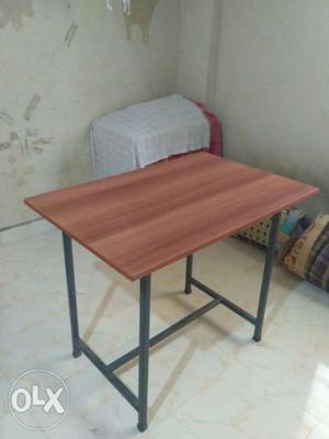 Brown Wooden Table With Black Metal Base