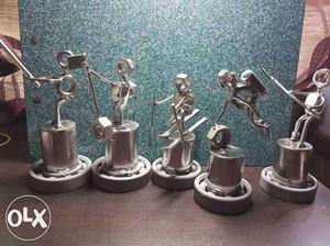 Five Grey Metal Figurines Of Musicians