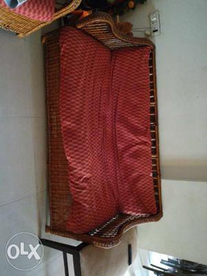 Red Padded With Brown Wicker Base Sofa
