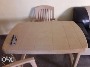 1 plastic table.. 3 chairs in good condition