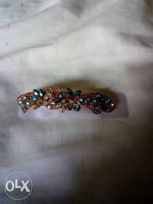 Beautiful hair clip with white and blue stones.