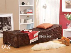 Brown Wicker Bed With Red Mattress