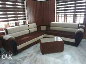Brown Wooden Framed White Padded Sectional Sofa