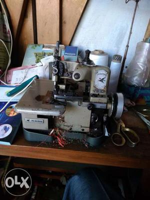Grey And Black Overlock Sewing Machine