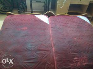 Two Quilted Maroon Mattresses