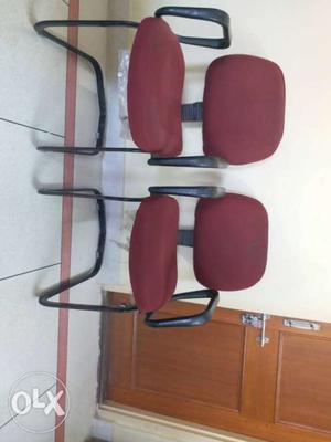 Two Red Steel Cantilever Chairs