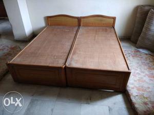 2 wooden beds (cots) without mattresses