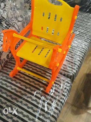 Baby's Orange And Yellow Plastic Rocking Chair
