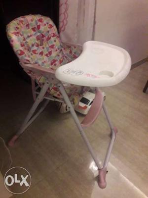 Baby's Pink And White High Chair