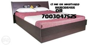 Brown Wooden Bed And White And Red Bed Sheet