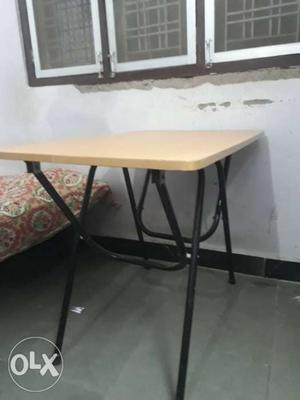 Foldable table and in good condition as new