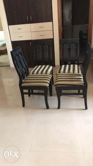 Four White-and-black Wooden Chairs