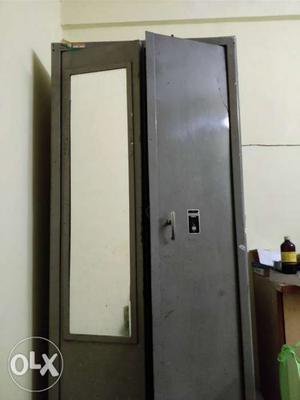 Metal Almirah with mirror and locker facility.