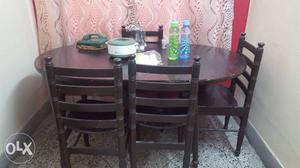 Oval Black Wooden Table With Four Chairs Set