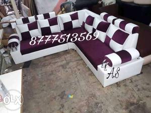 Purple And White Padded Corner Sofa With Throw Pillows