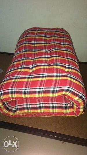 Red, Yellow, And Black Plaid Textile