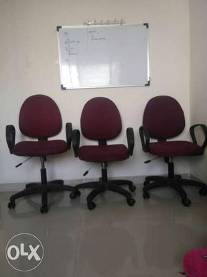 Three Red-and-black Office Rolling Chairs