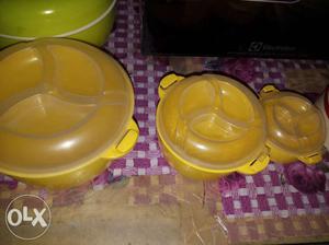 Three Round Yellow Plastic Containers