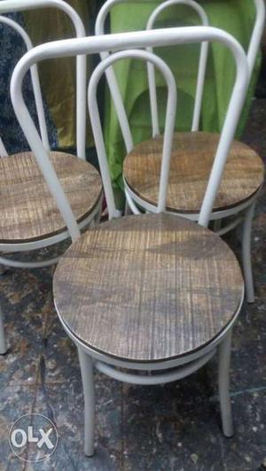 Two Brown Wooden Windsor Chairs
