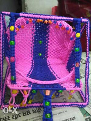 Baby's Pink And Blue Knitted Bouncer
