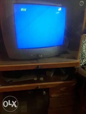 Black Flat Screen TV With Brown Wooden TV Stand