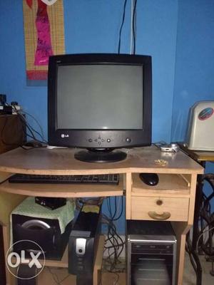 Gray CRT TV With Gray And Black Computer Tower