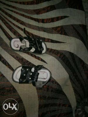Pair Of Black-and-white Leather Walking Sandals