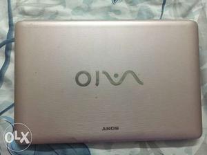 Silver-pink Sony Vaio laptop with warranty-screen and