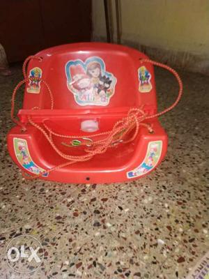 Toddler's Red Plastic Swing