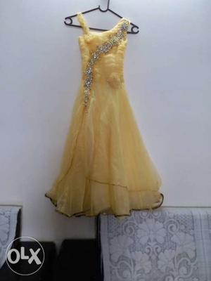 Yellow colour gown for 7 to 8 yrs.atual price is 