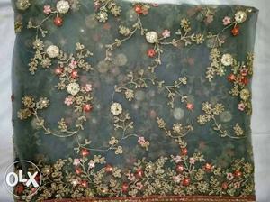 Blue, White, And Red Floral Textile