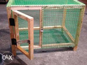 Brown Wooden And Green Plastic Pet Cage