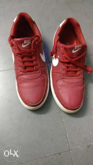 Pair Of Red Nike sneakers