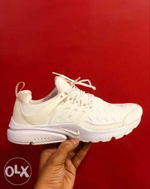 Pair of White Nike Presto Shoes
