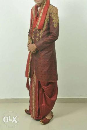 Reddish Maroon Shervani with golden Rajwadi hand