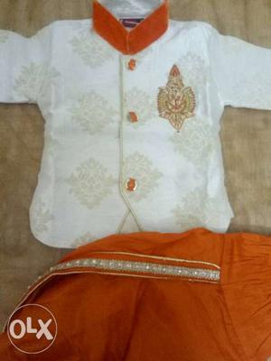 Cream and orange baby dhoti suit