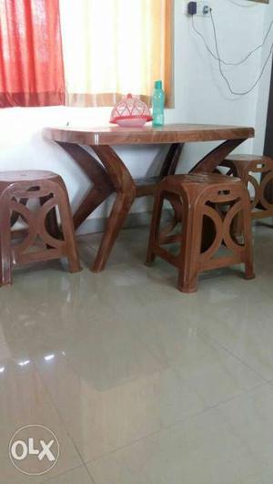 Dining table brown I'm colour with two chairs