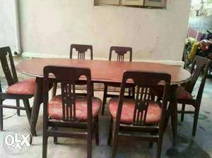 TeakWood dining room with cushion chairs in good