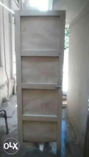 TeakWood frame iron door 6ft for disposal.