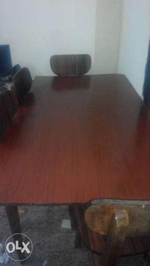 Wooden dining table with 4 wooden chairs.(6