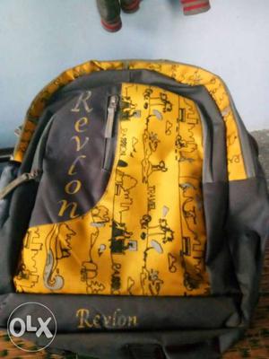Yellow And Black Revlon Backpack